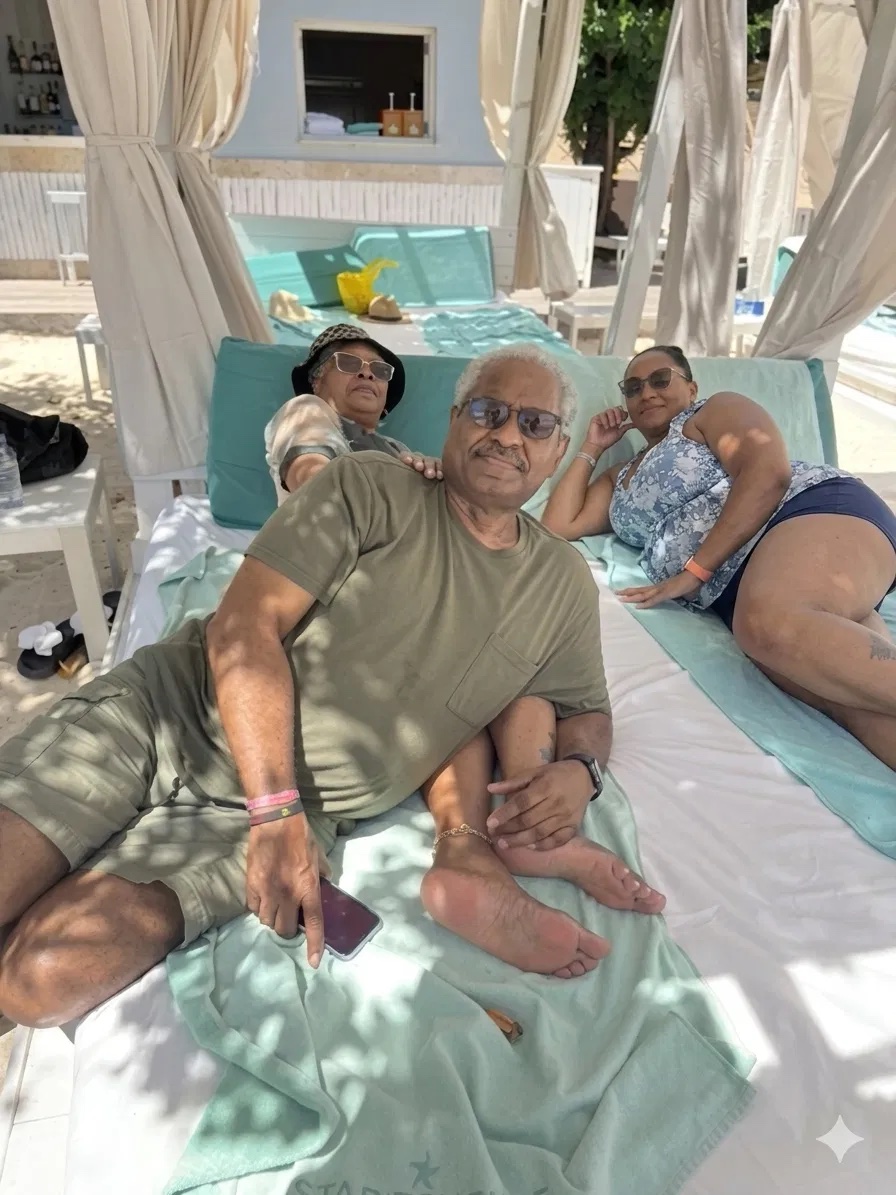 Patrice with her parents relaxing in a beachside cabana in Jamaica